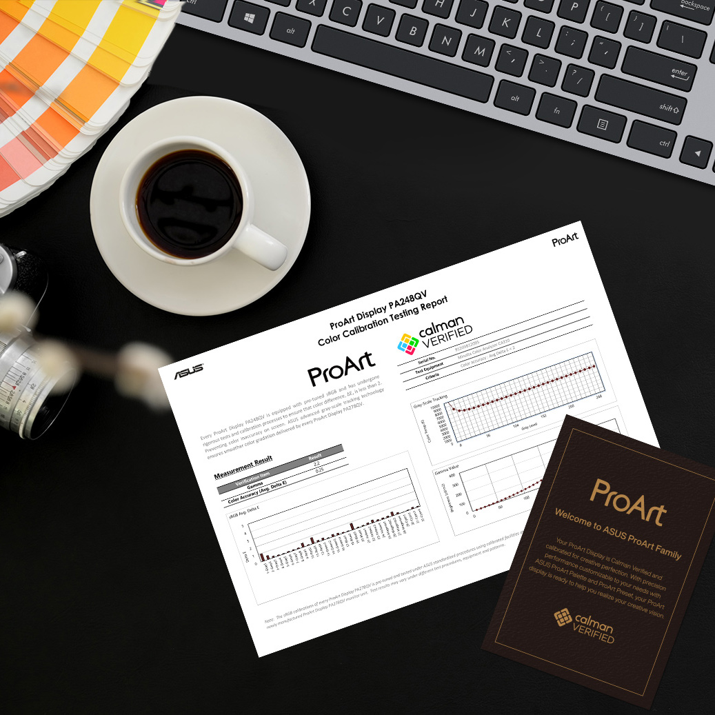 A color calibration test report of ProArt Display lies on a creator's desk